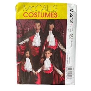May include: McCall's Costumes pattern for adult and children's vampire costumes. The package features a family dressed in black capes, red vests, and white ruffled shirts. The pattern number is M5212.