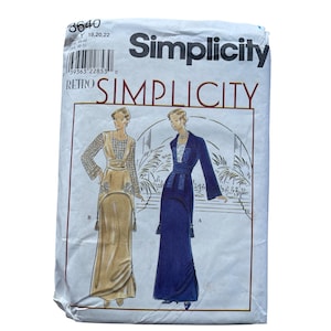 May include: A Simplicity sewing pattern envelope 8640 for size Y 18, 20, 22. The white paper package features illustrations of two long-sleeved floor-length dresses, one in gold and one in navy blue, with detailed embroidery and tassel accents.