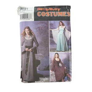 May include: Simplicity Costumes pattern featuring medieval-style dresses. The package shows three different dress designs in various colors, including a gray dress with bell sleeves and a brown dress with a square neckline. The package has the number 9891.