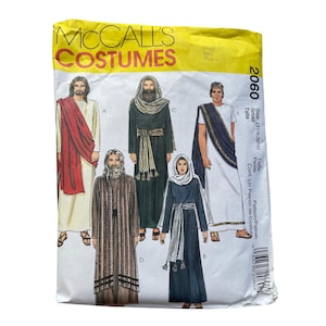 May include: A McCall's Costumes sewing pattern envelope 2060 for size Small. The front features illustrations of five historical or biblical style costumes in various colors including white, red, dark green, and black, with text labels A through E.