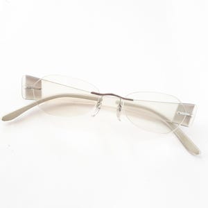 Silhouette 7597 6050 Eyeglasses women oval rimless silver ice glasses medium size from Austria frameless metal middle plastic temples used