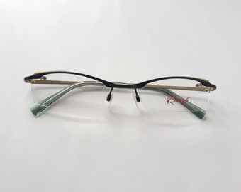 Kaos sessantatre occhiali da vista montatura nero senape angolare senza montatura in metallo da donna dalla Germania vintage 1990 NOS Brille
