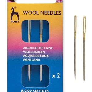 May include: A package of two assorted Pony wool needles, labeled "Wool Needles" and "Assorted." The package is blue and yellow with the Pony logo and the text "create beauty with Pony."
