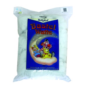 May include: A white bag containing 1000 grams of Hobbyboot brand stuffing for crafts. The bag features a blue and white label with a cartoon illustration of a clown, a girl, and a teddy bear on a crescent moon. The label reads "Bastel Watte" and "Bastelwatte aus waschbarer Synthetikfaser geeignet zum Füllen von Puppen, Stofftieren, Kissen etc."