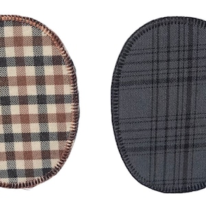 以下が含まれることがあります： 格子柄の楕円形の布パッチが2つ。1つのパッチは黒の格子柄で茶色と白、もう1つは黒の格子柄で灰色です。