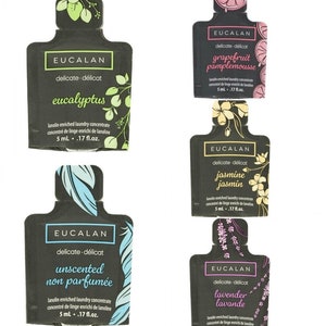 May include: Five single-use laundry detergent sachets with the brand name Eucalan. The sachets are black with white text and feature different floral designs and scents: eucalyptus, grapefruit, jasmine, unscented, and lavender.