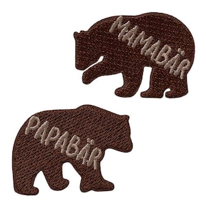 May include: Two brown bear-shaped embroidered patches. The top patch reads "MAMABÄR" in light brown thread. The bottom patch reads "PAPABÄR" in light brown thread. The patches are on a white background.
