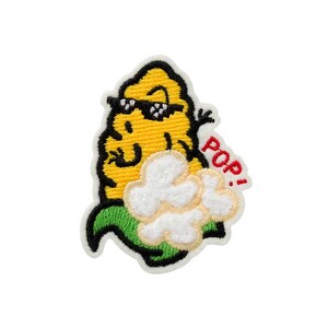 May include: A yellow cartoon corn wearing sunglasses and a green hat with a white popcorn cloud behind it. The text "POP!" is written in red on the cloud.