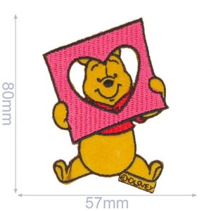 May include: A yellow Winnie the Pooh bear holding a pink heart-shaped frame with the word "DISNEY" at the bottom. The frame is 5.7 inches wide and 8 inches tall.