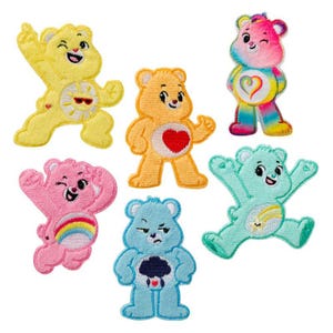 May include: A set of six embroidered patches featuring colorful cartoon bears. The collection includes a yellow bear with a sun, an orange bear with a red heart, a pink bear with a rainbow, a blue bear with a storm cloud, a teal bear with a shooting star, and a multi-colored bear with a heart emblem.