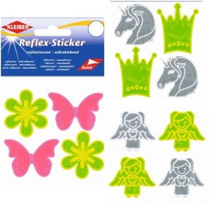May include: A sheet of reflective stickers with various designs, including flowers, butterflies, crowns, unicorns, and angels. The stickers are in shades of green, pink, and silver.