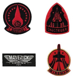 May include: Four embroidered patches with a red, black, and gold color scheme. The patches feature the words "Darkstar", "Ghostrider", "Maverick", and "Wingman".