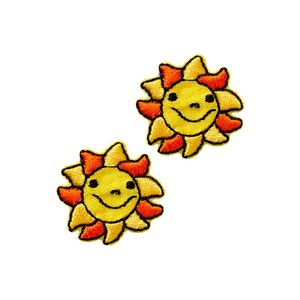 May include: Two yellow embroidered iron-on patches of smiling suns with orange rays.