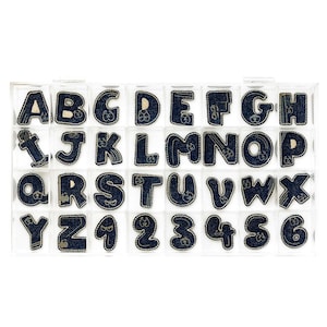 May include: A clear plastic case filled with 26 blue denim alphabet letter patches and 10 blue denim number patches. Each patch has a gold outline and a small gold design in the centre.