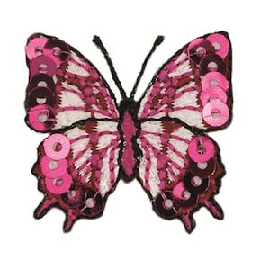 May include: Pink and white embroidered butterfly applique with pink sequins.