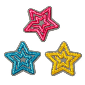 May include: Three embroidered star patches in pink, blue, and yellow. Each star has a gray border and a nested star design. The patches are likely for clothing or craft projects.