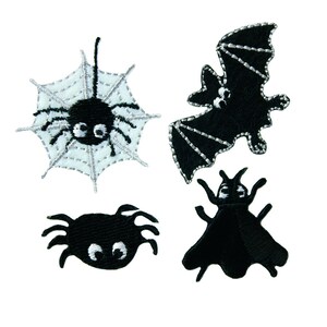 May include: Four black embroidered iron-on patches featuring Halloween themes: a spider in a web, a bat, a spider, and a fly.