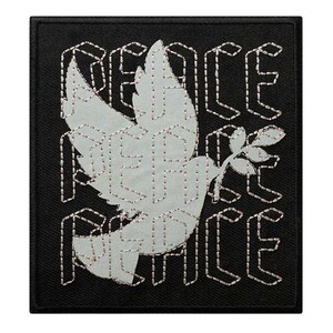May include: Square black patch featuring a dove carrying an olive branch, with the word "PEACE" in a repeating pattern. The dove and text are light gray with a stitched outline.