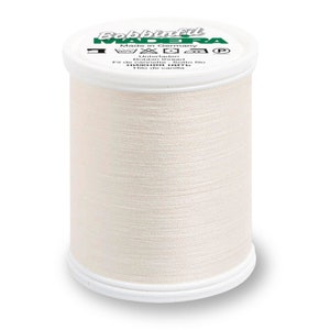 May include: A white spool of Madeira Bobbinfil thread with a green label that reads "Madeira Bobbinfil Made in Germany Unterfaden Bobbin Thread Fil de cannette Sotto filo Нижняя нить Hilo de canilla".