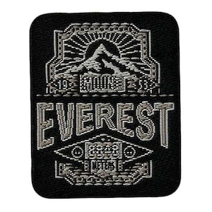 May include: Black and white embroidered patch with the word "EVEREST" in a stylised font. The patch features a mountain range design with a sunburst above it.