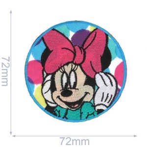 May include: A round, colourful iron-on patch featuring a cartoon image of Minnie Mouse with a pink bow and a blue and green polka dot background. The patch is 72mm in diameter.