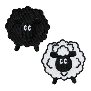 May include: Two embroidered sheep patches. One is black with a black face and legs, and the other is white with a black face and legs. Both have large, oval eyes and a fluffy, textured appearance.