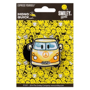 May include: Yellow and orange embroidered iron-on patch of a smiley face van with a peace sign on the front. The patch is on a background of yellow smiley faces. The text "SMILEY" is on the van. The text "MONO QUICK" and "SMILEY World" are on the packaging.