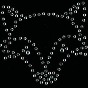 May include: A black background with a design of white rhinestones in the shape of a stylized animal face.