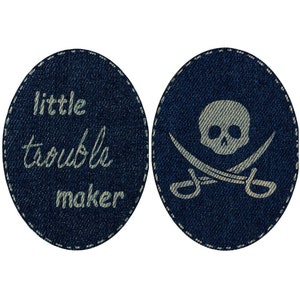 May include: Two denim patches, one with a skull and crossbones and the other with the text "little trouble maker" in white.