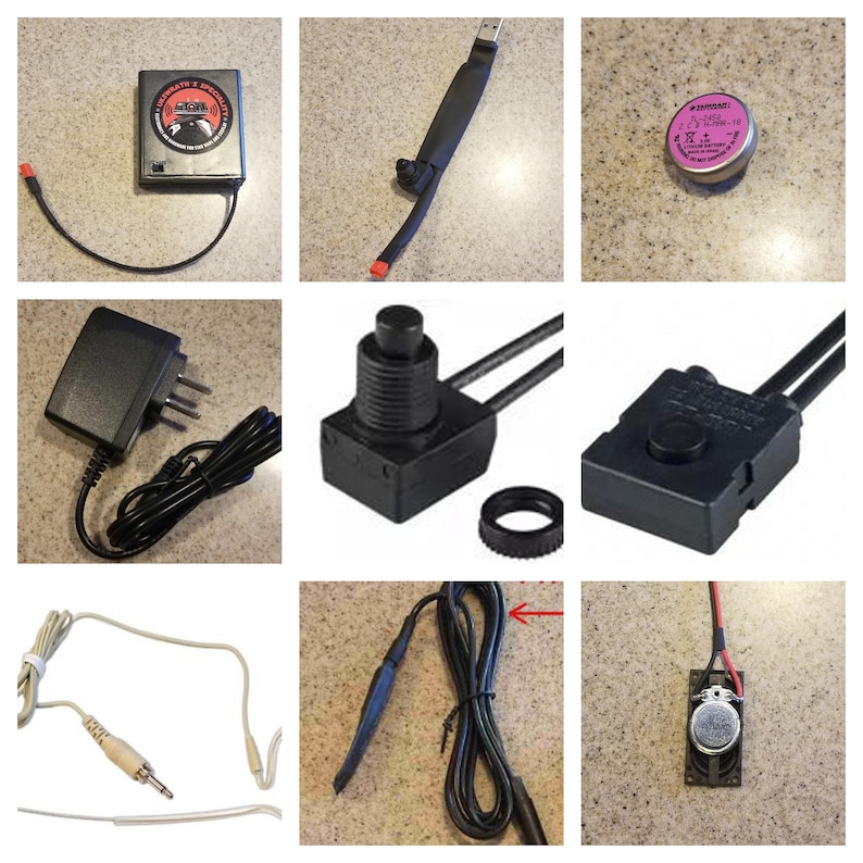 May include: A collection of electronic components, including a black box with text, a USB cable, a pink battery, a power adapter, several black switches, a microphone, and a small speaker.