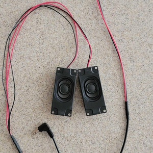 Universal audio speakers with connecting audio harness