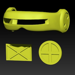 May include: A set of three yellow plastic pieces for a costume. The pieces include a headband with a visor, a square piece with an X, and a round piece with a cross.