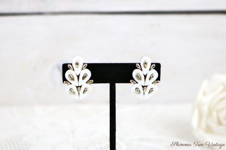 CORO White Thermoset Lucite and silver tone Clip on Earrings