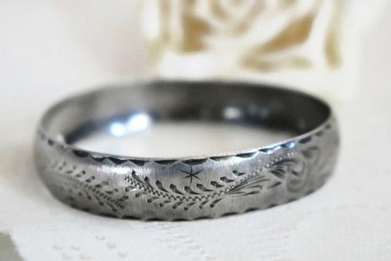 Sterling Silver bangle Bracelet with scrolling feather leaf etching.