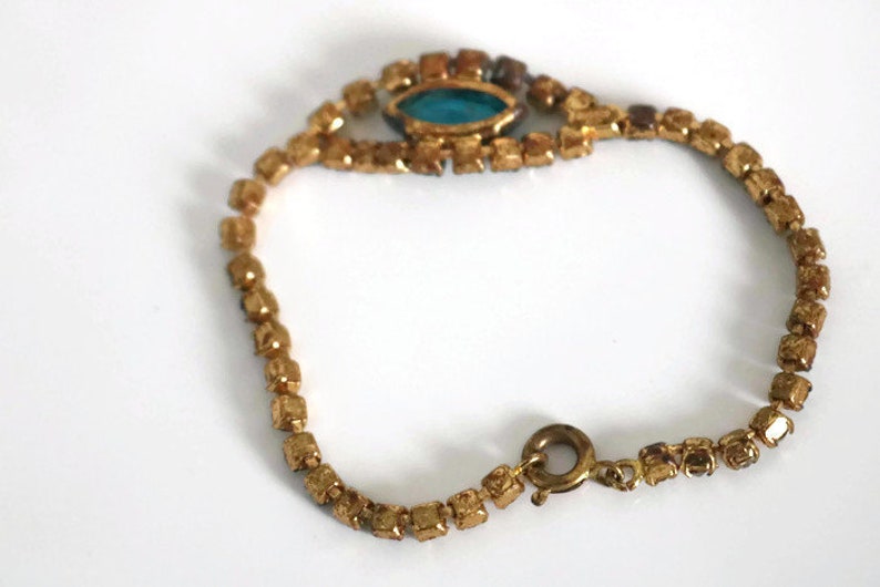 Bracelet Signed Czecho Crystal rhinestone with Blue marquise cut focal piece Gold tone metal.