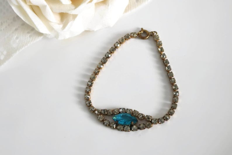 Bracelet Signed Czecho Crystal rhinestone with Blue marquise cut focal piece Gold tone metal.
