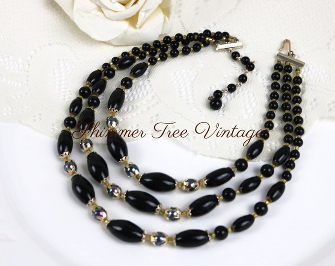 Black multi strand beaded celluloid/plastic necklace, made in Japan.