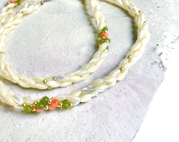 Lovely Twisted Shell beaded necklace with elegant green and pink beads.