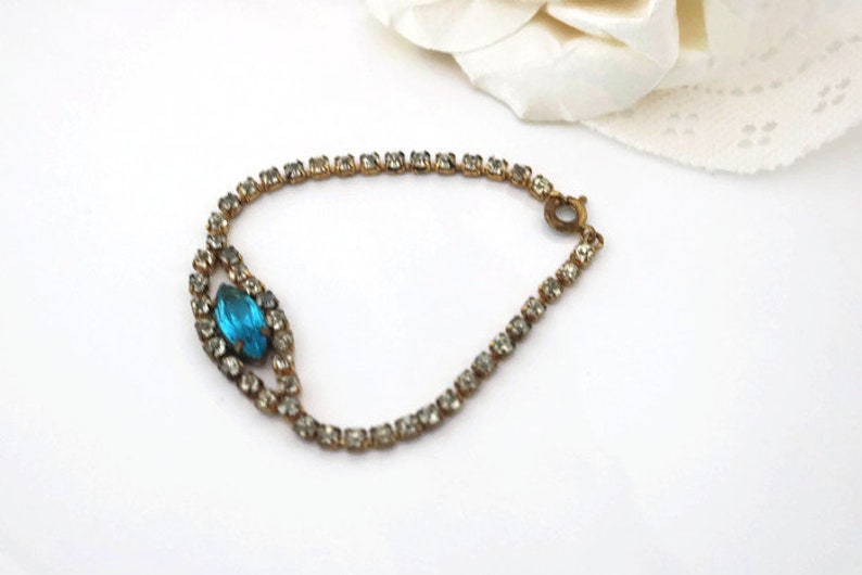 Bracelet Signed Czecho Crystal rhinestone with Blue marquise cut focal piece Gold tone metal.