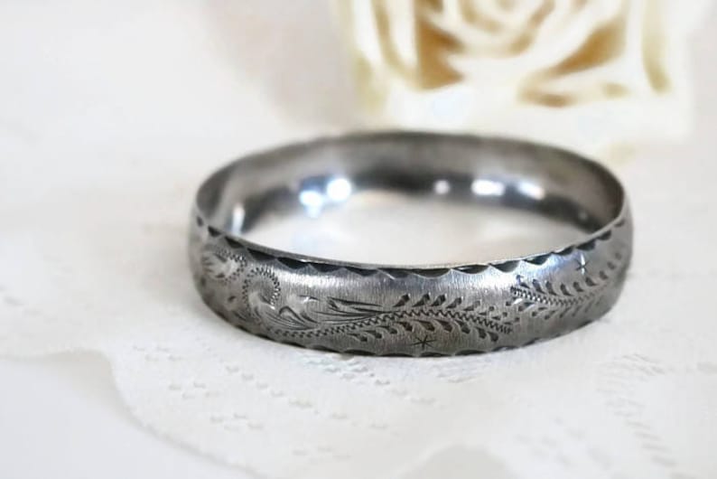Sterling Silver bangle Bracelet with scrolling feather leaf etching.