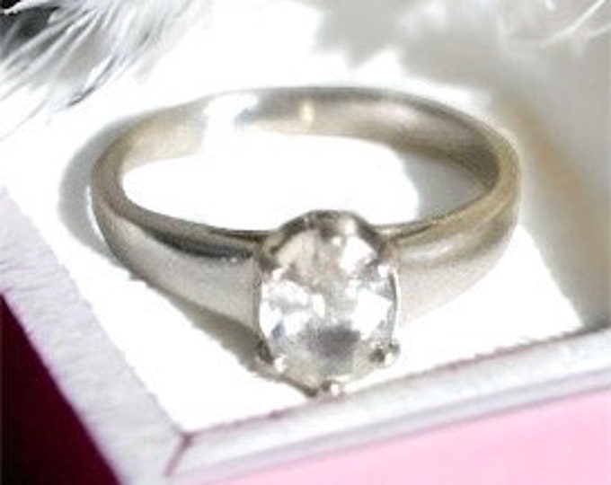 Sterling silver ring with beautiful 1.25 Carat clear Cubic Zirconia setting. Marked 925 BBJ Thailand