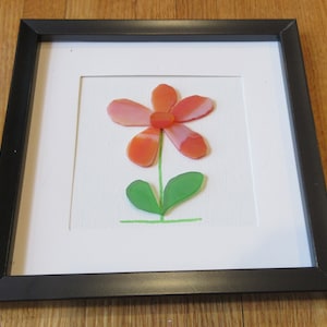 SEA GLASS  Art Picture-&quot;a beautiful wild flower &quot; framed in black frame great gift for a flower lover nice color just in time for summer