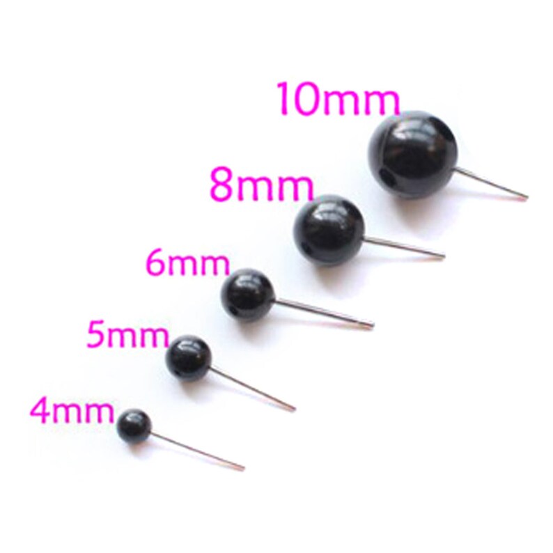 May include: Five black plastic safety eyes with metal pins in different sizes: 4mm, 5mm, 6mm, 8mm, and 10mm.