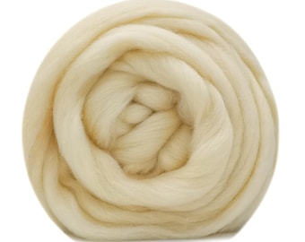 May include: A close-up of a ball of cream-colored wool roving. The wool is soft and fluffy, and it is perfect for spinning or felting.