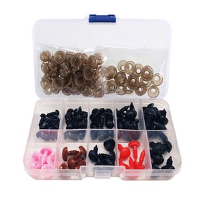 May include: A clear plastic storage box filled with assorted plastic safety eyes for crafts. The box has 10 compartments, each filled with a different color and size of eyes. The eyes are black, brown, red, and pink.