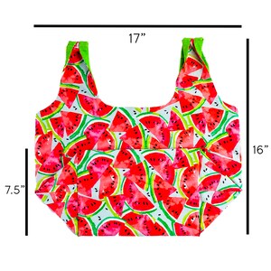 May include: A reusable shopping bag with watermelon print. The bag is 17 inches wide and 16 inches tall. It has two green straps.