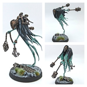 May include: A ghostly figure with a black hooded cloak and chains attached to metal cages. The figure is painted in shades of green and brown, and is posed in a dynamic, floating position.