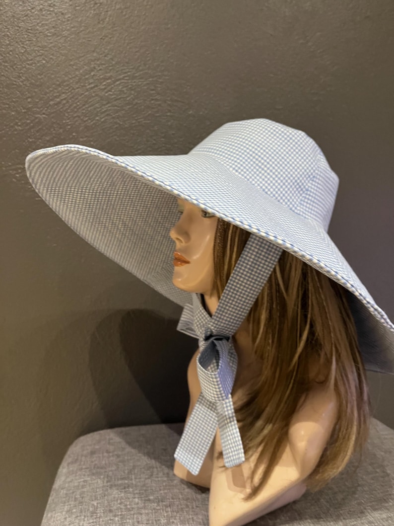 A romantic wide-brim hat in soft blue and white gingham, designed for effortless elegance and timeless summer style. Cotton hat image 12