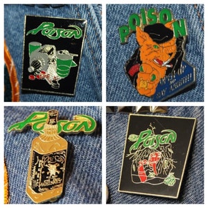 May include: Four different enamel pins featuring the band Poison. The first pin is black with a green, white, and red image of a drummer. The second pin is black with a green, white, and red image of a fox wearing a hat and smoking a cigarette. The third pin is black with a green, white, and red image of a bottle of whiskey. The fourth pin is black with a green, white, and red image of a fox in a jungle scene.