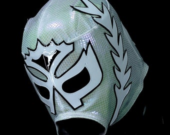 May include: A white wrestling mask with a black design and a silver iridescent finish. The mask has a large, stylised letter "D" on the front.